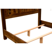 Wooden bed frame with slatted design on a white background